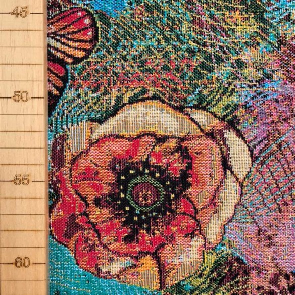 Tejido Jacquard AQUAMARINA con mariposas multicolor y fondo azul. Ancho 140
