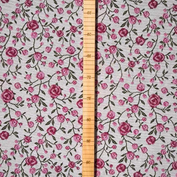 WINS jacquard fabric with pink flowers and green leaves. Width: 140 cm
