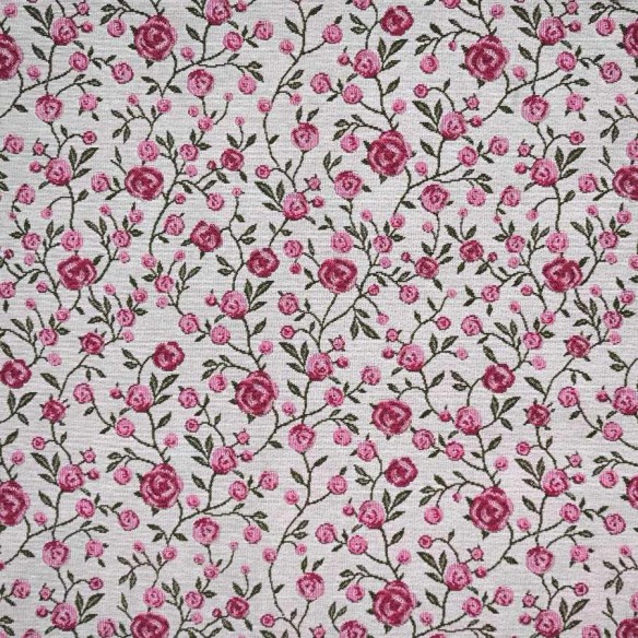 WINS jacquard fabric with pink flowers and green leaves. Width: 140 cm