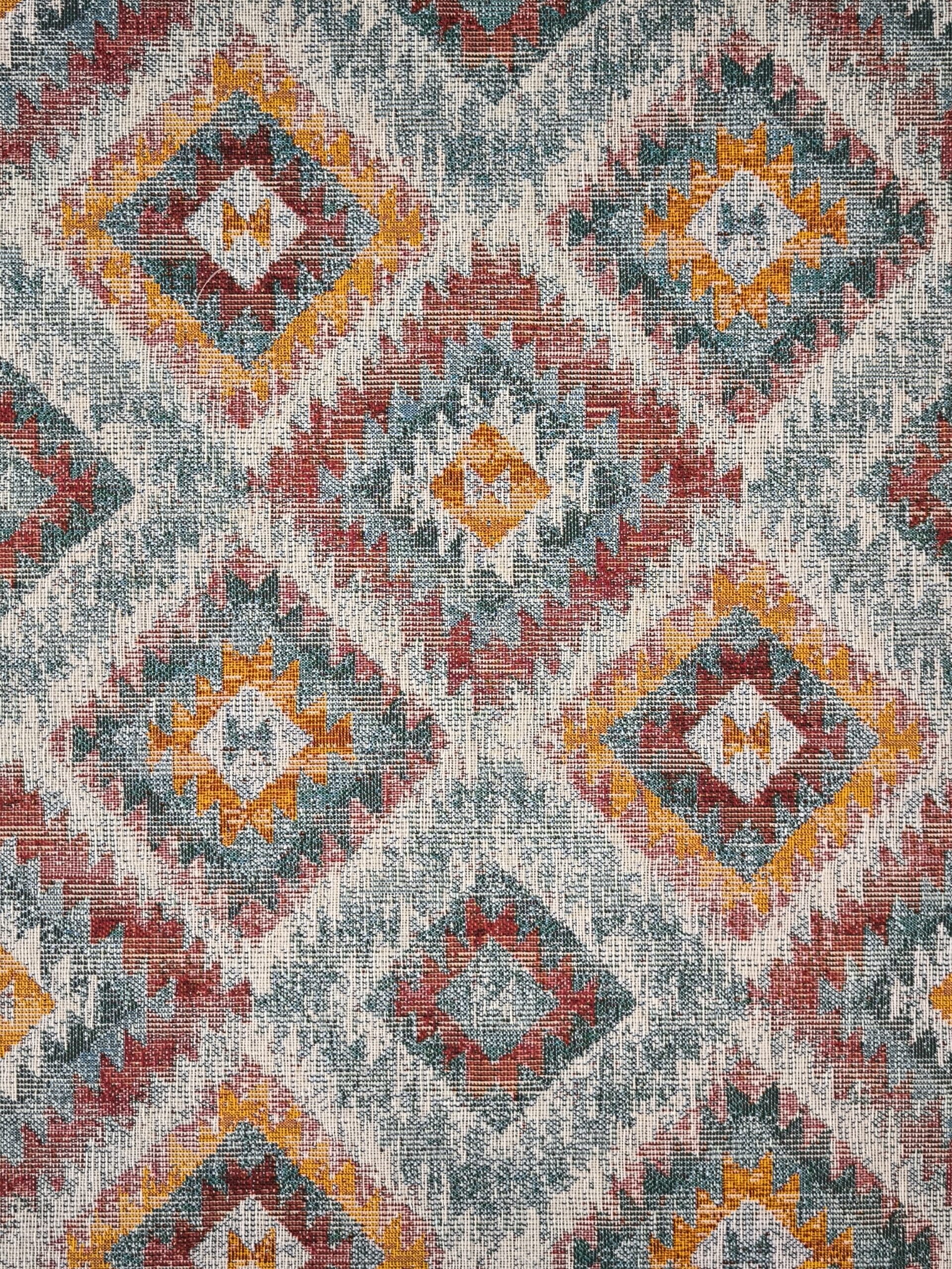 Tejido Jacquard LOSANGO Ikat con motivos geometricos rojos verdes y amarillos. Ancho 140